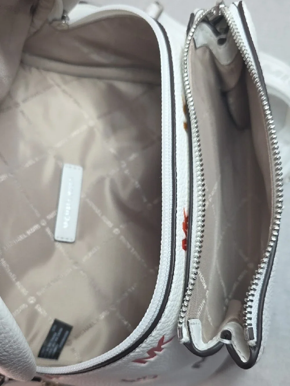 Michael Kors Slater Medium Rainbow Logo Embossed Sling Pack in Optic White